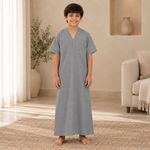 Boy wearing the gray jalabiya