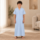 Boy wearing the light blue jalabiya