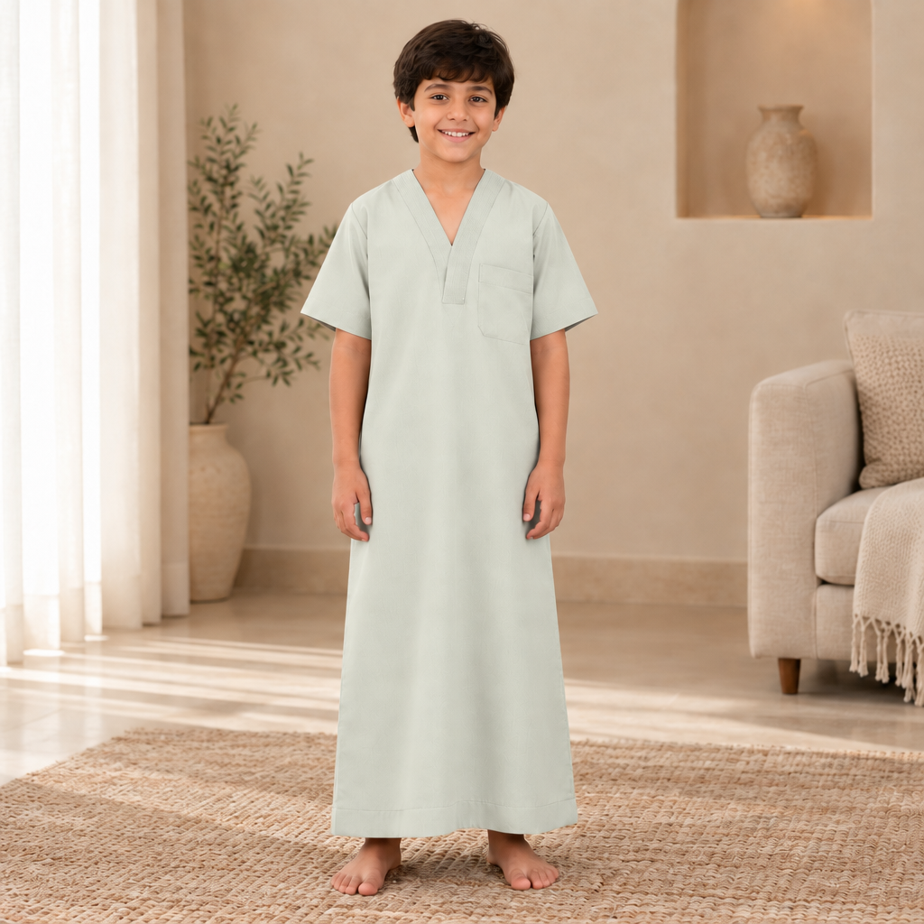Boy wearing the pale gray-green jalabiya