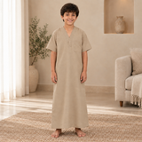 Boy wearing the sand jalabiya