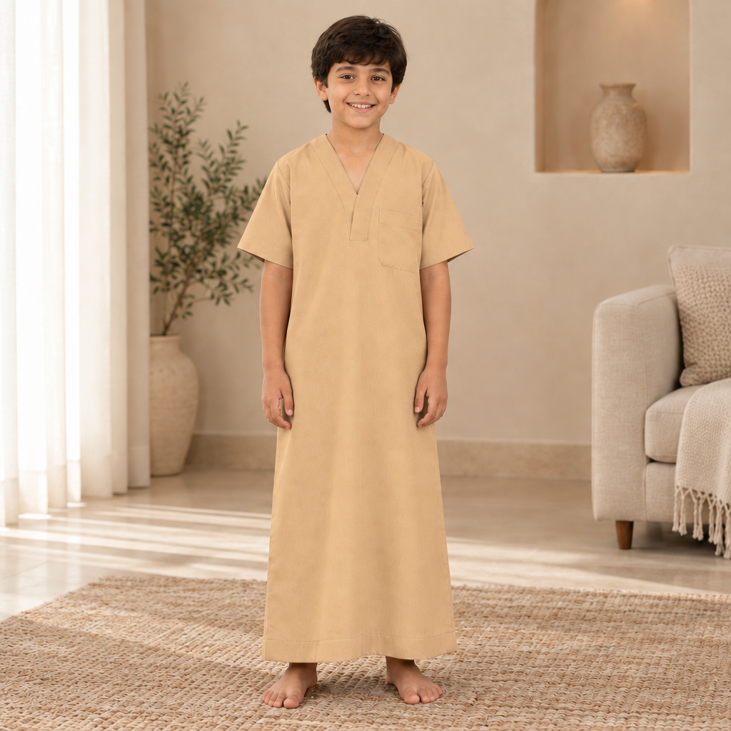 Boy wearing the warm sandy beige jalabiya