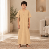Boy wearing the warm sandy beige jalabiya